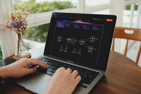 Bangkok, Thailand. July 9, 2025; A person uses the n8n workflow automation platform on a laptop, designing a visual flowchart to connect different apps and services.