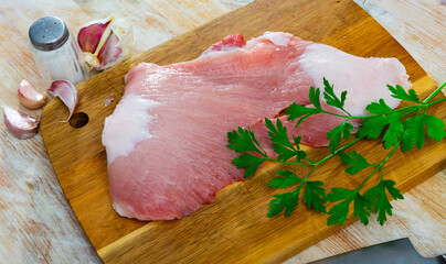 Fresh meat, raw pork Secreto steak and spices prepared for cooking on wooden background