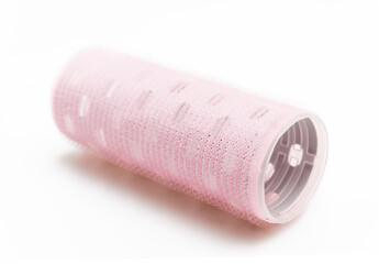 Pink Self-Adhesive Hair Roller for Voluminous Hairstyling and Bangs Isolated on White Background