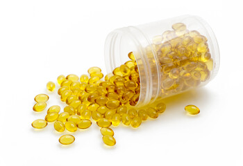 Vitamin D Softgel Capsules Spilled from Brown Glass Bottle on White Isolated Background &ndash; Dietary Supplement for Health