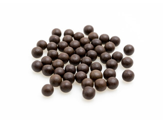 Chinese Herbal Medicine Pills Spilled from Brown Glass Bottle on White Isolated Background – Traditional Asian Medicinal Pills