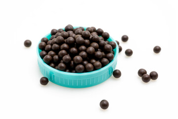 Chinese Herbal Medicine Pills Spilled from Brown Glass Bottle on White Isolated Background – Traditional Asian Medicinal Pills