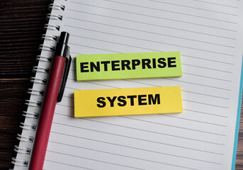 Concept of enterprise system write on sticky notes isolated on Wooden Table.