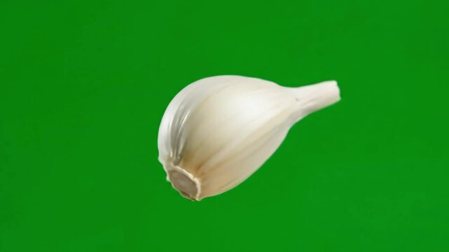 Garlic Cloves Isolated on Green Screen Background in Various Angles and Positions