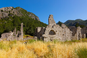 Landscape of the ancient city of Olympos. With the remaining ruins of walls. Turkey