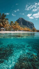 Crystal clear waters reveal vibrant coral beneath a tropical paradise with a majestic mountain backdrop on a sunny day