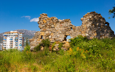 Naula Ancient City ruins among modern buildings of Mahmutlar, district of Alanya, Turkey.