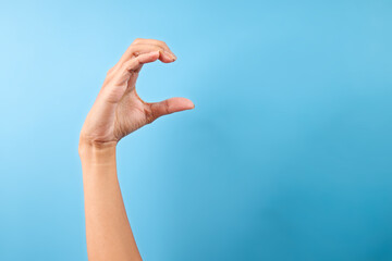 Finger Spelling Letter C In Sign Language On Blue Background