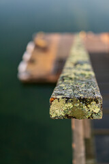 Weathered wood railing on a dock