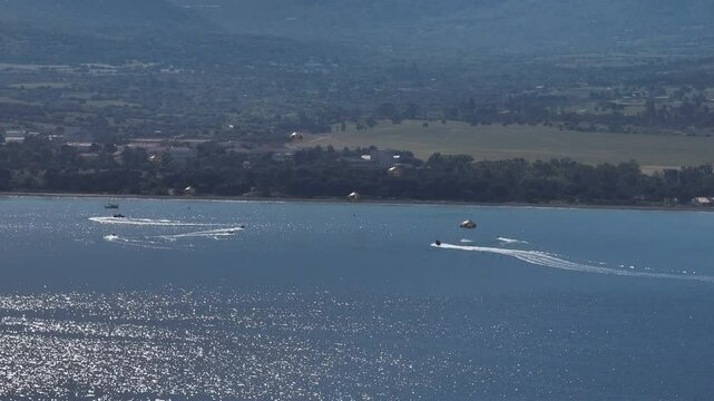 Water Recovery Teams in Action After Aerial Parachute Deployment
