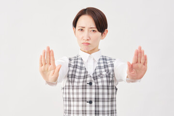 女性　事務員　ストップのジェスチャー　白背景