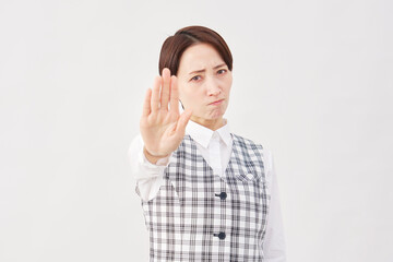 女性　事務員　ストップのジェスチャー　白背景
