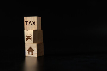 Property and Vehicle Tax Concept with Wooden Blocks