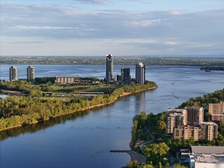 Obraz premium Nuns' Island residential buildings, bridge, and traffic at the sunset, Montreal, Quebec, Canada...
