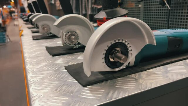 New angle grinders on shelf in hardware store with power tools display
