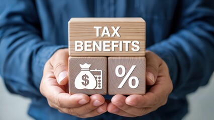 Man holds wood blocks showing tax benefits concept for finance