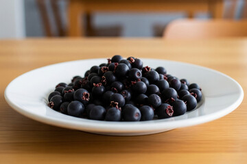 These vibrant Saskatoon berries, a native superfood, offer a delightful blend of sweet and tart flavors, perfect for a healthy and delicious treat.