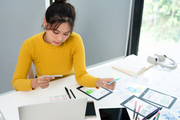 Female ux developer and ui designer , mobile app interface wireframe design. App developer working...