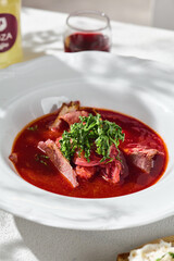 Beef borscht in sunlight, bright mood, overhead composition