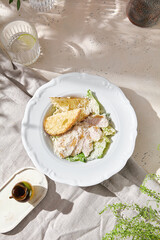 Chicken Caesar salad, bright natural lighting, overhead composition with leafy greens and parmesan