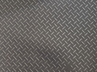 metal diamond plate texture with anti slip pattern, industrial steel floor background.
