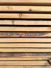 side view of wooden pine planks, construction of natural materials, pattern of lumber