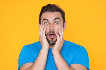 Portrait of shocked unshaven caucasian man afraid and shocked with surprise expression, fear and...
