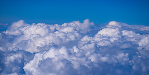 Dreamy cloudscape above. Sky with white clouds. Sky background design. Many clouds. Puffy cumulus...