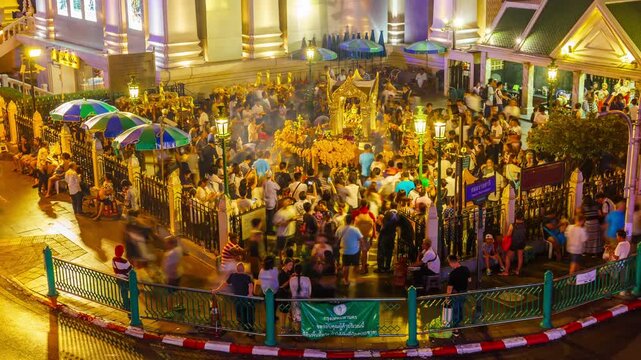 Timelapse of Erawan Temple Phra Phrom at Ratchaprasong Intersection is popular with tourists from all over the world for seeking fortune at night.
