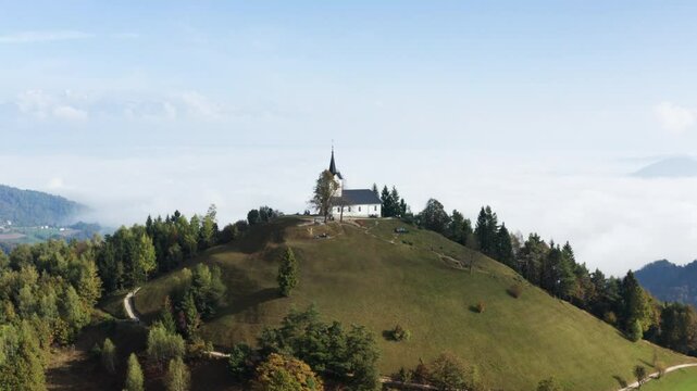 The Church Of Saint Thomas On Top Of A Hill Near Skofja Loka, Slovenia. Aerial Drone Shot