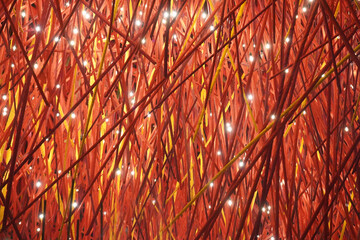 Abstract Installation of Interwoven Red Sticks with Embedded Festive Lights