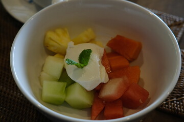 Tropical Fruit Salad with Yogurt in a Bowl