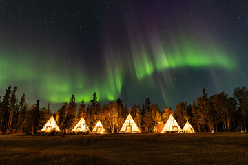 Northern Lights, Aurora Borealis over Teepee and Forest, Yellowknife, Northwest Territories, Canada © Seongpil Jang