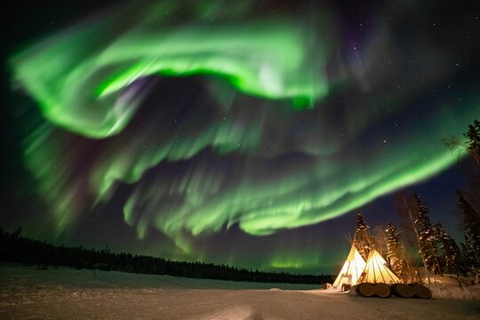 Northern Lights, Aurora Borealis over Teepee and Forest, Yellowknife, Northwest Territories, Canada