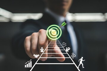 Businessman pointing towards a glowing target with an arrow and a pyramid of business icons success