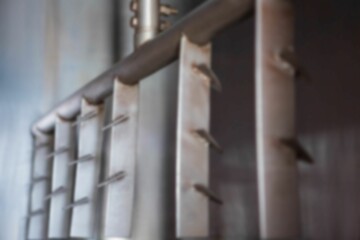 Metal structure against wall in factory