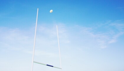 Rugby ball flying between posts © vectorfusionart