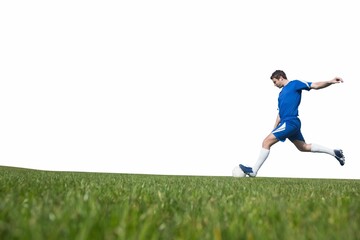 Football player kicking ball