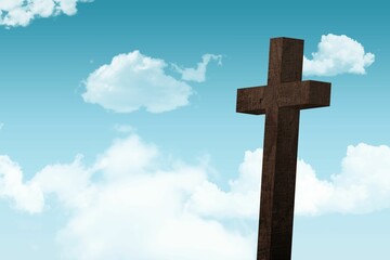 Dark brown wooden cross is standing against vibrant blue sky with fluffy white clouds, flat design