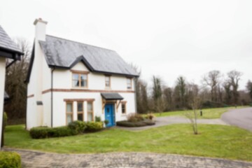 Lawn in front of house against sky