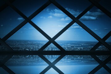 Room with large window looking on city