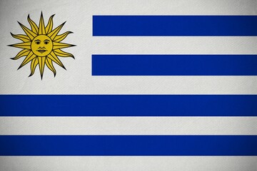 Uruguay national flag is showing in flat design with golden sun emblem and white-blue stripes