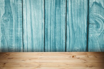 Flat design showing wooden tabletop with grain detail against weathered teal-blue plank wall