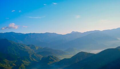 Beautiful landscape mountain green field grass meadow white cloud blue sky on sunny day. Majestic green scenery big mountain hill cloudscape valley panorama view in countryside greenery pasture