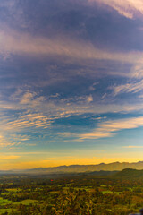 Vertical Horizon Sunset mountain range beautiful landscape mist foggy sunrise beam. Golden sky Mountain landscape mountain. Vertical Amazing Landscape cloud sky on sunrise. Gold sunlight heaven scene