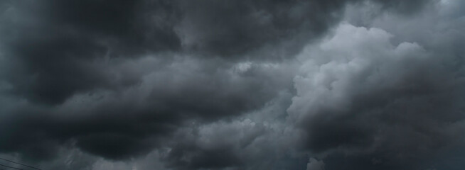 Banner Dramatic dark storm clouds black sky background. Dark thunderstorm clouds rainny season....