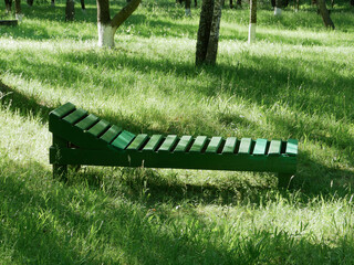 Wooden lounger in nature for relaxation.