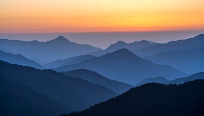Obraz premium Mountain Range Silhouette at Sunset with Colorful Sky