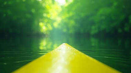 Yellow Kayak on Calm Water Amidst Green Forest