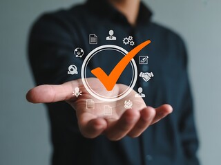 Orange checkmark inside circle with icons around it held by a person approval success